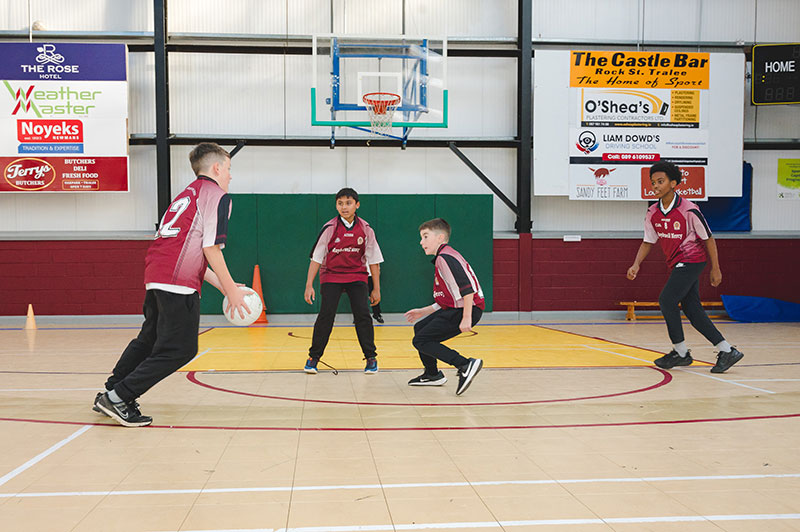 Moyderwell Mercy National School students playing football in gym