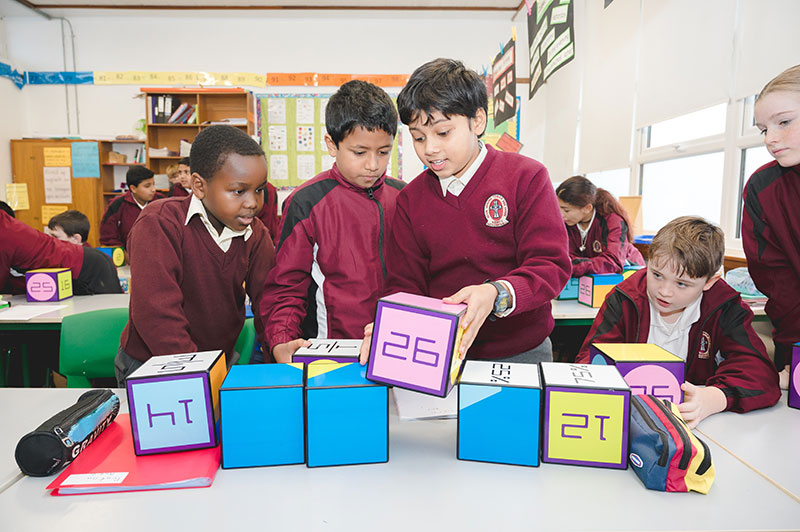 Moyderwell Mercy National School students playing with number blocks